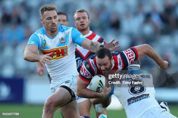 Boyd Cordner of the Roosters is tackled during the round 12 NRL match between the Sydney Roosters and the Gold Coast Titans at Central Coast Stadium...