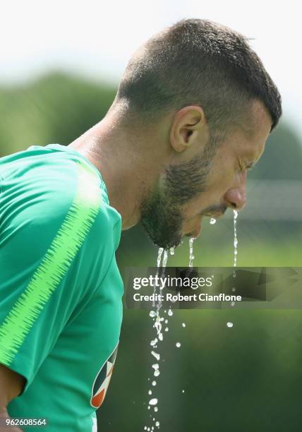 Nikita Rukavytsya of Australia looks to cool down during the Australian Socceroos Training Session at the Gloria Football Club on May 26, 2018 in...