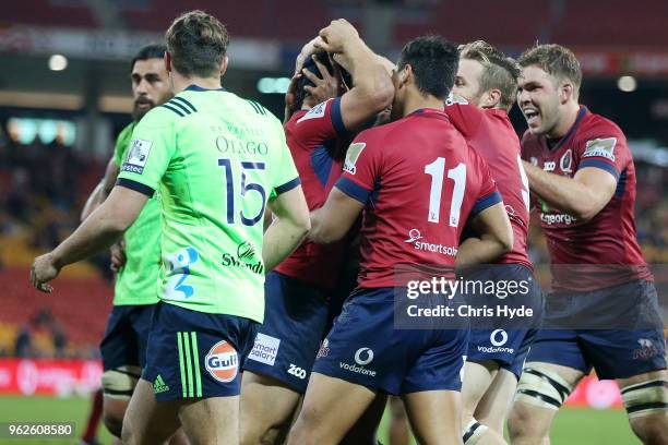 Hamish Stewart of the Reds celebrates a try a try during the round 15 Super Rugby match between the Reds and the Highlanders at Suncorp Stadium on...