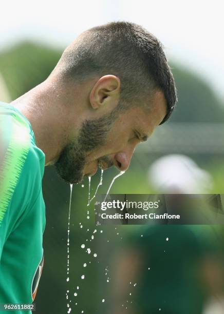 Nikita Rukavytsya of Australia looks to cool down during the Australian Socceroos Training Session at the Gloria Football Club on May 26, 2018 in...