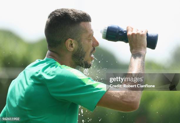 Nikita Rukavytsya of Australia looks to cool down during the Australian Socceroos Training Session at the Gloria Football Club on May 26, 2018 in...