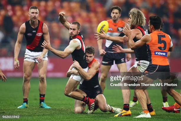 David Zaharakis of the Bombers handpasses during the round 10 AFL match between the Greater Western Sydney Giants and the Essendon Bombers at...
