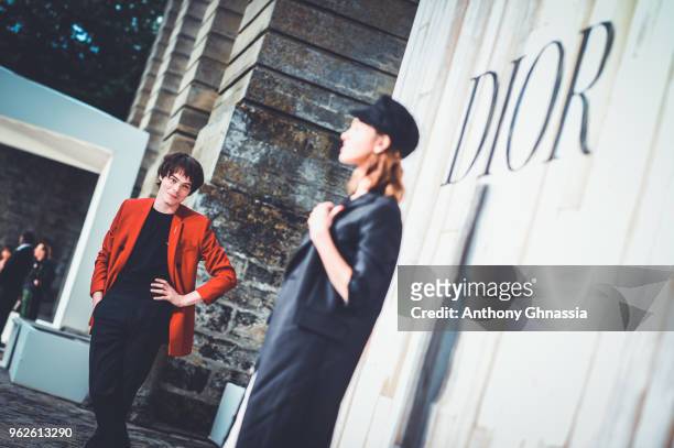 Charlie Heaton and Natalia Dyer attend a photocall during Christian Dior Couture S/S19 Cruise Collection on May 25, 2018 in Chantilly, France.