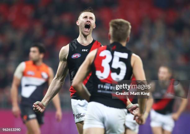 Shaun McKernan of the Bombers celebrates a goal during the round 10 AFL match between the Greater Western Sydney Giants and the Essendon Bombers at...