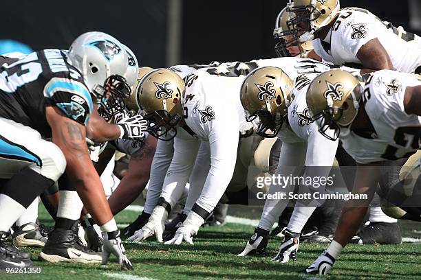 Members of the New Orleans Saints line up at the line of scrimmage against the Carolina Panthers at Bank of America Stadium on January 3, 2010 in...