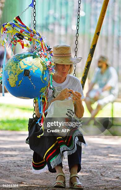 Demonstrator rests in a balance during the closure of the 2010 World Social Forum, on January 29, 2010 in Porto Alegre, Brazil. The Forum ends today...