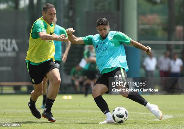 Mark Milligan of Australia challenges Dimitri Petratos during the Australian Socceroos Training Session at the Gloria Football Club on May 26, 2018...