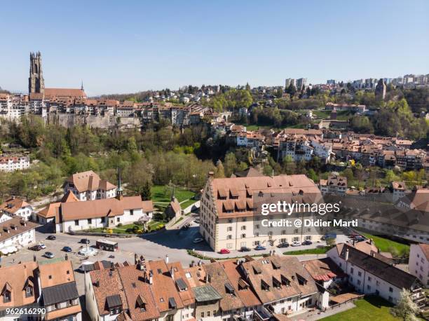 aerial view of fribourg medieval old town with its famous cathedral in switzerland - freiburg skyline stock pictures, royalty-free photos & images