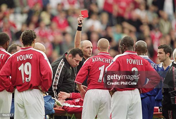 Steve Brown of Charlton is shown the red card by referee Mike Dean as he is stretchered off during the FA Barclaycard Premiership match between...
