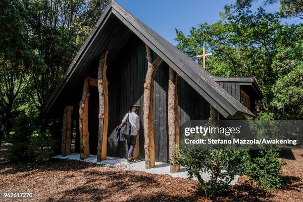 Visitors enter a chapel at Santa Sede at Isola di San Giorgio Maggiore during the press preview at the 16th. International Architecture Biennale on...