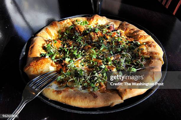 Delia's Mediterranean Grill in Alexandria serves a 10-inch Prosciutto White pizza that has ricotta, prosciutto, pine nuts, fresh micro greens and fig...