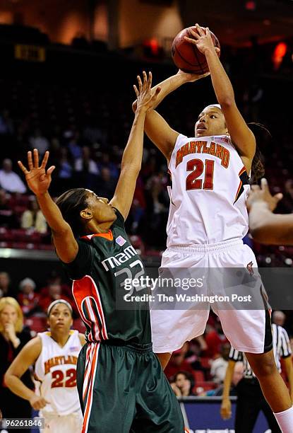 January 21: Maryland f Tianna Hawkins hits a floater in the lane over Miami defender Morgan Stroman on January 21, 2010 in College Park, Md. (Photo...