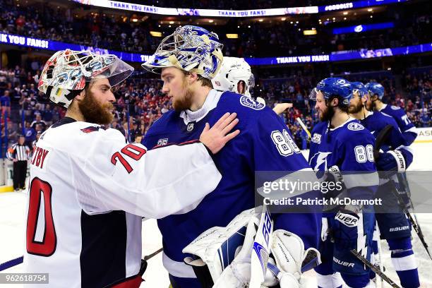 Braden Holtby of the Washington Capitals shakes hands with Andrei Vasilevskiy of the Tampa Bay Lightning after Game Seven of the Eastern Conference...