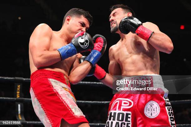 Robert Guerrero lands a left hand against Omar Figueroa at the Nassau Veterans Memorial Coliseum on July 15, 2017 in Uniondale, New York. Figueroa...