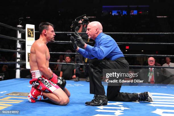 Referee Ron Lipton gives an eight count to Robert Guerrero at the Nassau Veterans Memorial Coliseum on July 15, 2017 in Uniondale, New York. Guerrero...