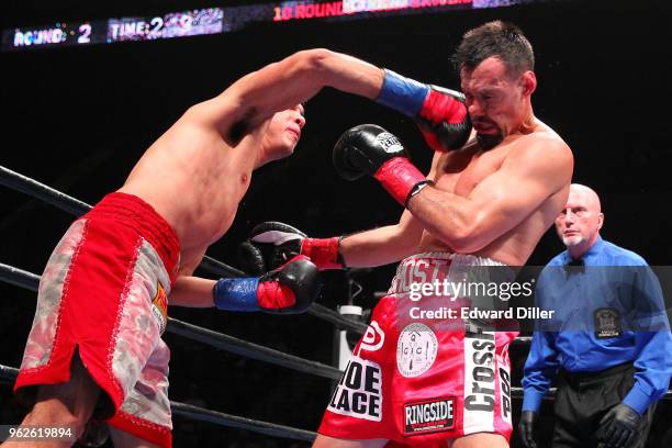 Omar Figueroa lands a right hand against Robert Guerrero at the Nassau Veterans Memorial Coliseum on July 15, 2017 in Uniondale, New York. Figueroa...