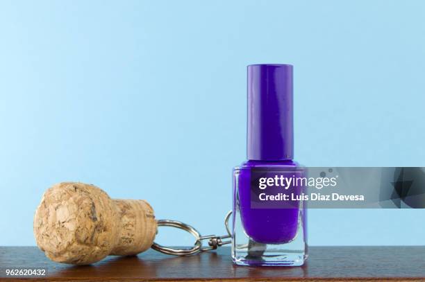 cava cork keyring holding  purple  nail polish - purple nail polish stock pictures, royalty-free photos & images