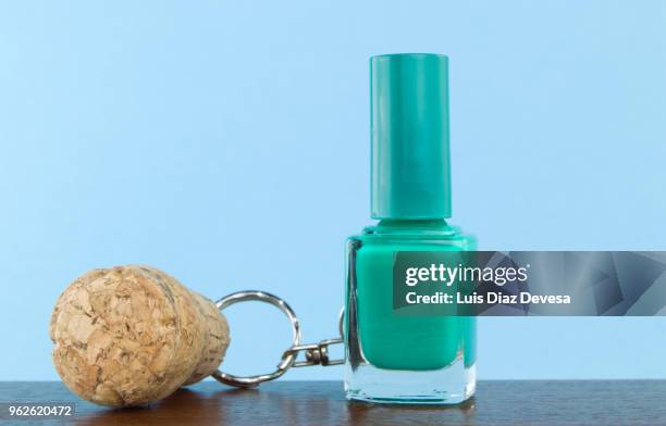 cava cork keyring holding green nail polish - cork stopper bildbanksfoton och bilder