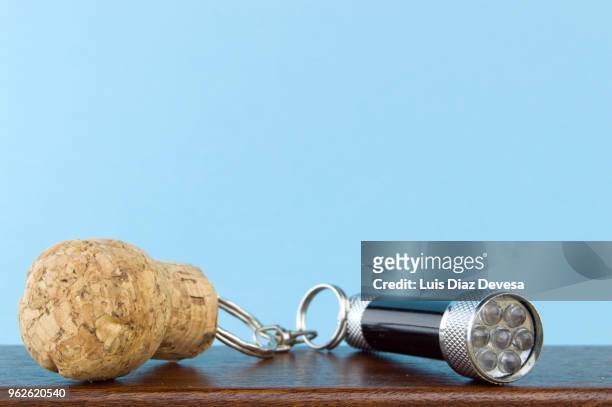 cava cork keyring holding flashlight - bottle stopper stock pictures, royalty-free photos & images