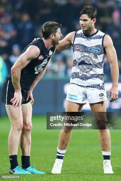 Tom Hawkins talks with Sam Rowe of the Blues after the round 10 AFL match between the Geelong Cats and the Carlton Blues at GMHBA Stadium on May 26,...