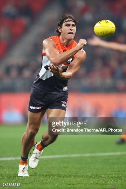Ryan Griffen of the Giants handpasses during the round 10 AFL match between the Greater Western Sydney Giants and the Essendon Bombers at Spotless...