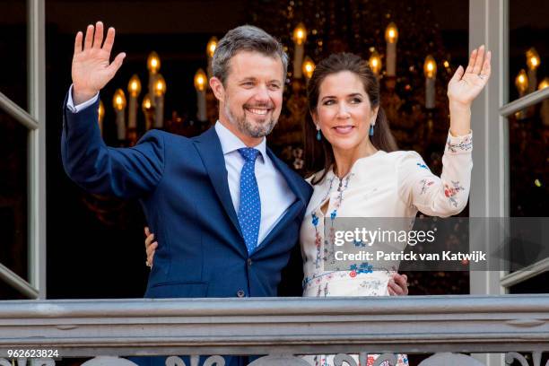 Crown Prince Frederik of Denmark and Crown Princess Mary of Denmark appear on the balcony as the Royal Life Guards carry out the changing of the...