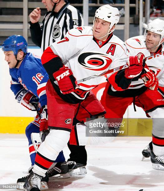 Rod Brind'Amour of the Carolina Hurricanes looks for the puck against Sean Avery of the New York Rangers on January 27, 2010 at Madison Square Garden...