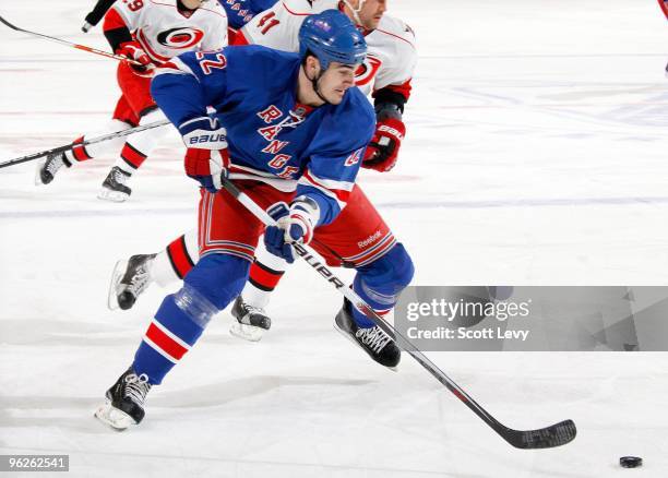 Brian Boyle of the New York Rangers skates with the puck against the Carolina Hurricanes on January 27, 2010 at Madison Square Garden in New York...