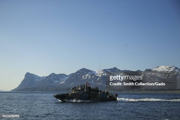 Photograph of US marines and Norwegian Costal Ranger Commandos onboard a CB90-class fast military assault craft during a joint training exercise in...