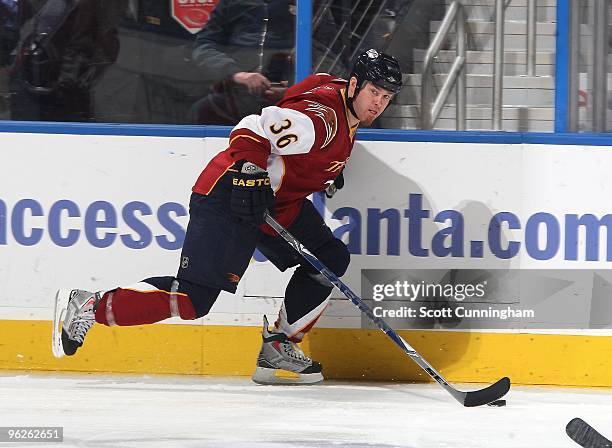 Eric Boulton of the Atlanta Thrashers carries the puck against the Carolina Hurricanes at Philips Arena on January 21, 2010 in Atlanta, Georgia.