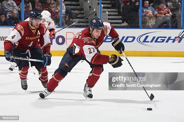 Chris Thorburn of the Atlanta Thrashers carries the puck against the Carolina Hurricanes at Philips Arena on January 21, 2010 in Atlanta, Georgia.