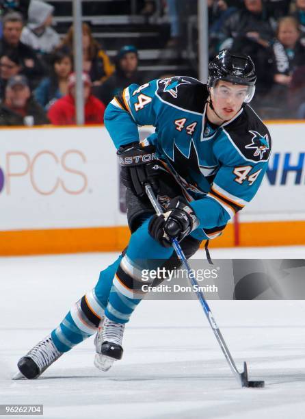 Marc-Edouard Vlasic of the San Jose Sharks controls the puck down the ice during an NHL game against the Buffalo Sabres on January 23, 2010 at HP...