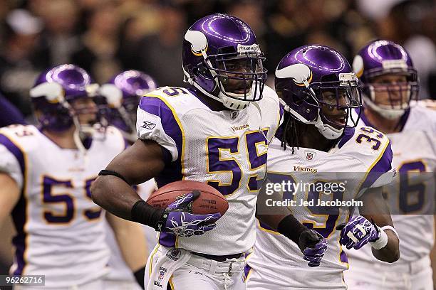 Kenny Onatolu and Husain Abdullah of the Minnesota Vikings react after Onatolu recovered a fumble on a muffed punt against the New Orleans Saints...