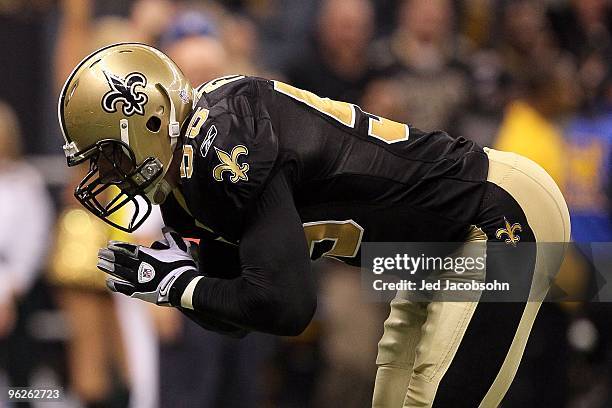 Scott Fujita of the New Orleans Saints bows as a gesture after a defensive stop against the Minnesota Vikings during the NFC Championship Game at the...