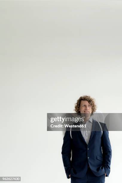 businessman wearing suit and angel's wings - man angel wings stock pictures, royalty-free photos & images