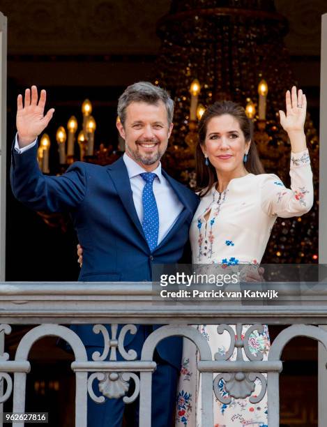 Crown Prince Frederik of Denmark and Crown Princess Mary of Denmark appear on the balcony as the Royal Life Guards carry out the changing of the...