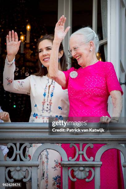 Queen Margrethe of Denmark and Crown Princess Mary of Denmark appear on the balcony as the Royal Life Guards carry out the changing of the guard on...