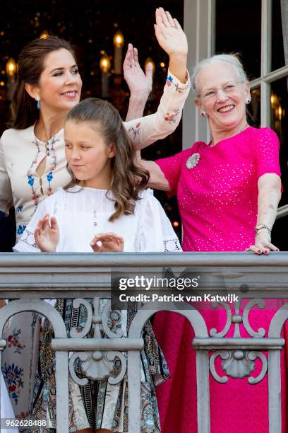Crown Princess Mary of Denmark, Queen Margrethe of Denmark and Princess Isabella of Denmark appear on the balcony as the Royal Life Guards carry out...