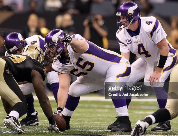 Center John Sullivan of the Minnesota Vikings gestures as Brett Favre calls the snap count at the line of scrimmage against the New Orleans Saints...