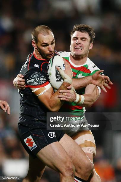 Simon Mannering of the Warriors is tackled by Angus Crichton of the Rabbitohs during the round 12 NRL match between the New Zealand Warriors and the...