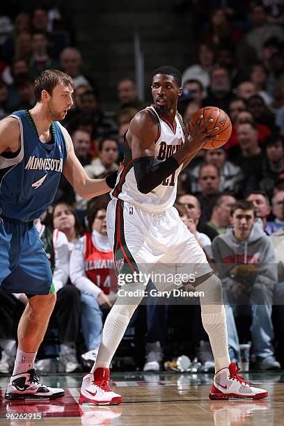 Hakim Warrick of the Milwaukee Bucks handles the ball against Oleksiy Pecherov of the Minnesota Timberwolves during the game on January 23, 2010 at...