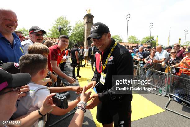 Schalk Brits of Saracens greets fans as he arrives at the stadium for his last game before retirement prior to the Aviva Premiership Final between...