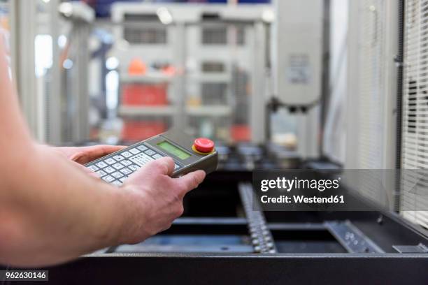 Manually Operating Machine Closeup Of Man Operating Machine In Factory High-Res Stock Photo ...
