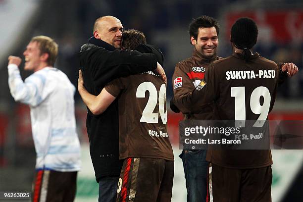 Headcoach Holger Stanislawski of St. Pauli celebrates with Matthias Lehmann after winning the Second Bundesliga match between MSV Duisburg and FC St....