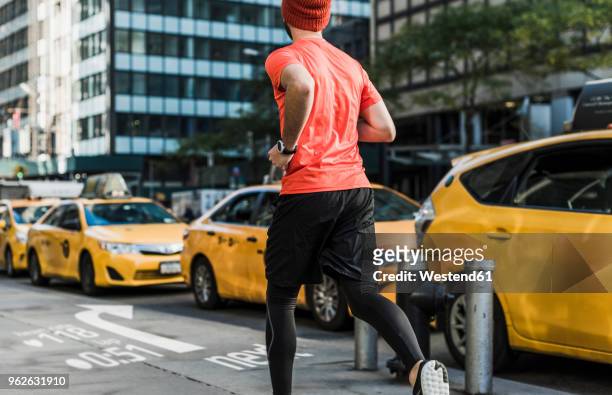 usa, new york city, man running in the city with data on pavement - running man heartbeat stock pictures, royalty-free photos & images