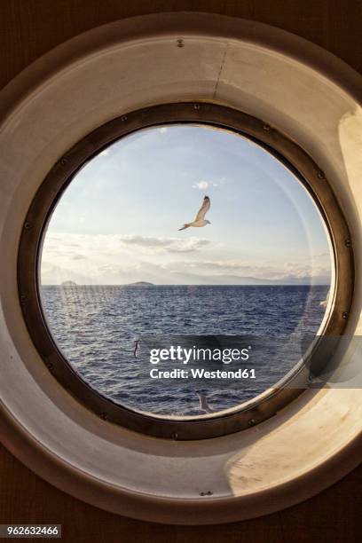 sea view through porthole - cruise ship stock-fotos und bilder