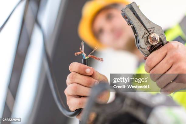 close-up of electrician working with wire cutter - wire cutters stock pictures, royalty-free photos & images