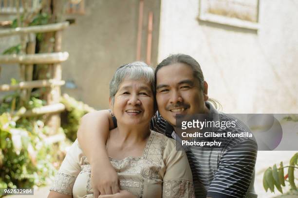 mother and son - filipino culture stock pictures, royalty-free photos & images