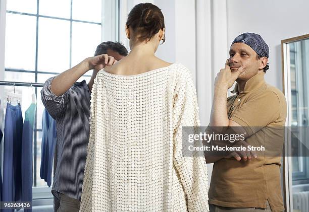 Fashion designer Isaac Mizrahi with a model at his studio in 2008.