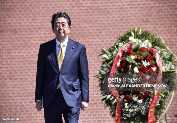 Japanese Prime Minister Shinzo Abe attends a wreath laying ceremony at the Tomb of the Unknown Soldier in Moscow on May 26, 2018.